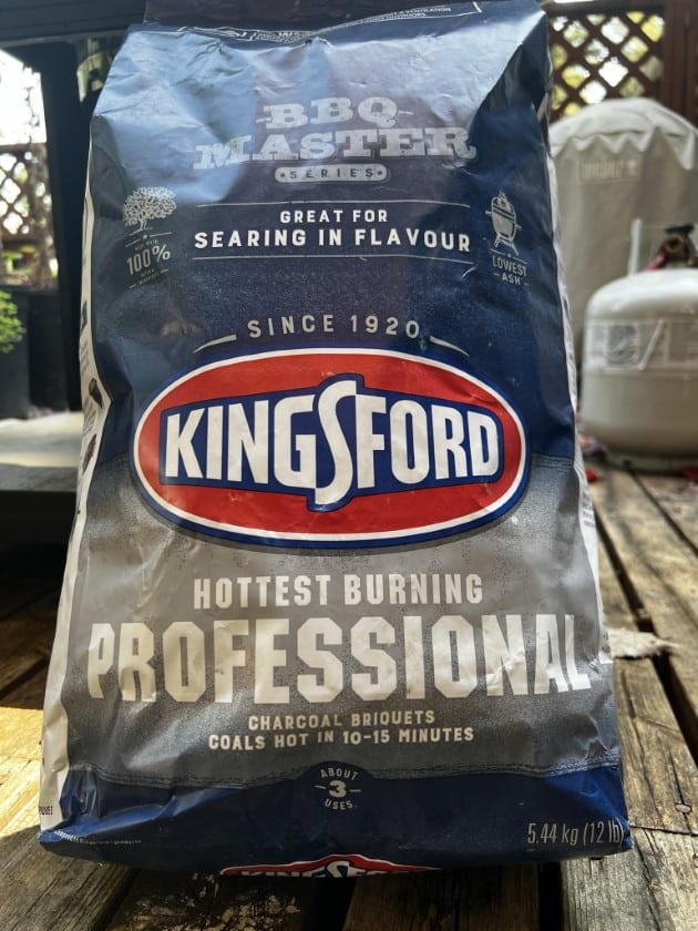 Bag of Kingsford Professional charcoal briquettes.