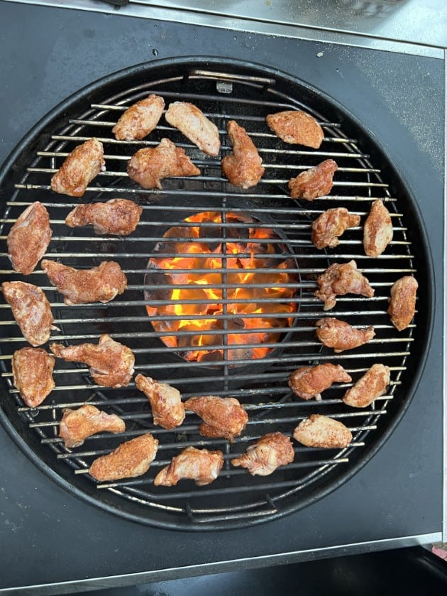 Canadian chicken wings spread around the vortex on the weber kettle grill.
