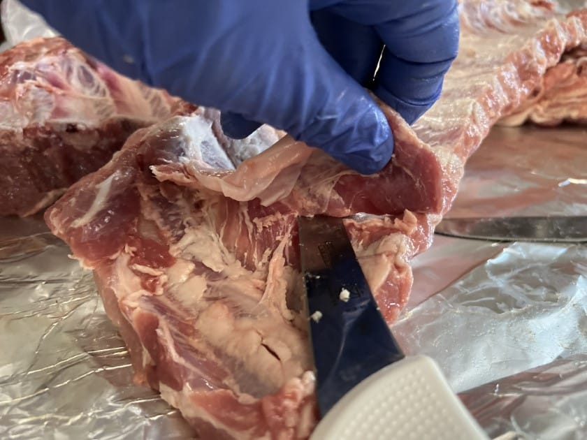 Trimming baby back ribs.